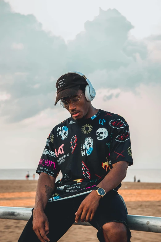 a person sits with headphones on his ears