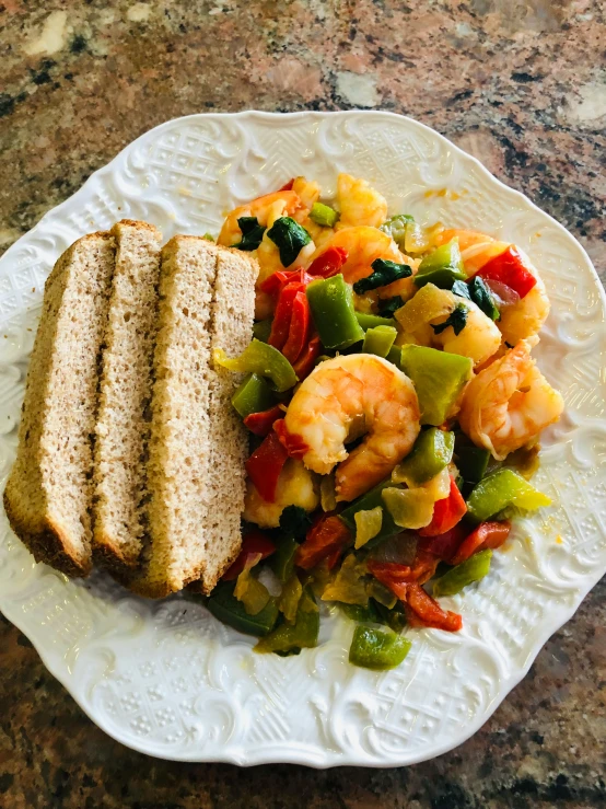 some bread and other foods on a white plate