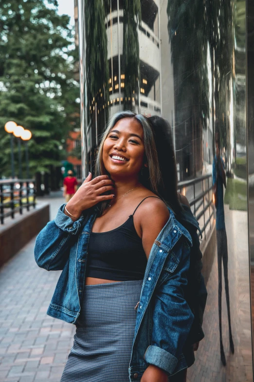 a woman smiles near the window of a building