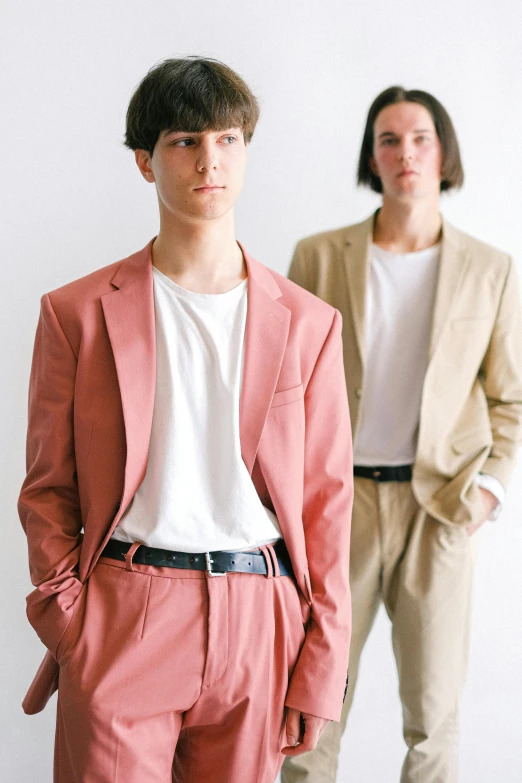 two models standing in front of white wall