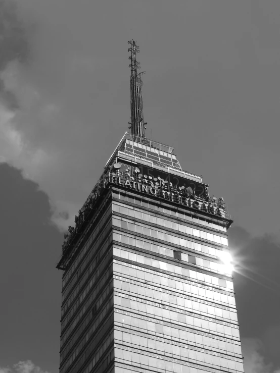 a large tall building with a sky in the background