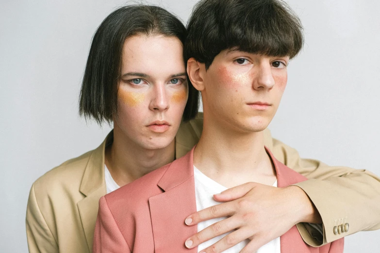 two young men with painted face makeup on their foreheads