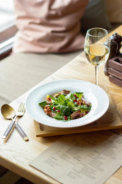 a plate full of green vegetables on a table