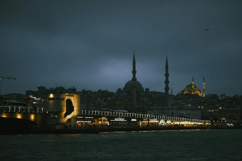 the lights on a city skyline lit up by buildings