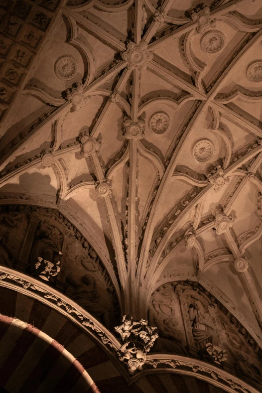 an ornate ceiling in a cathedral, with lights