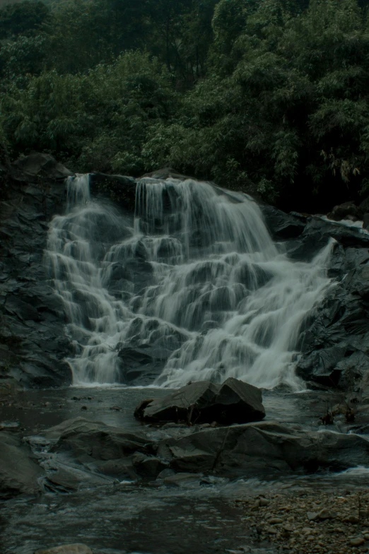 water falling down the side of a cliff