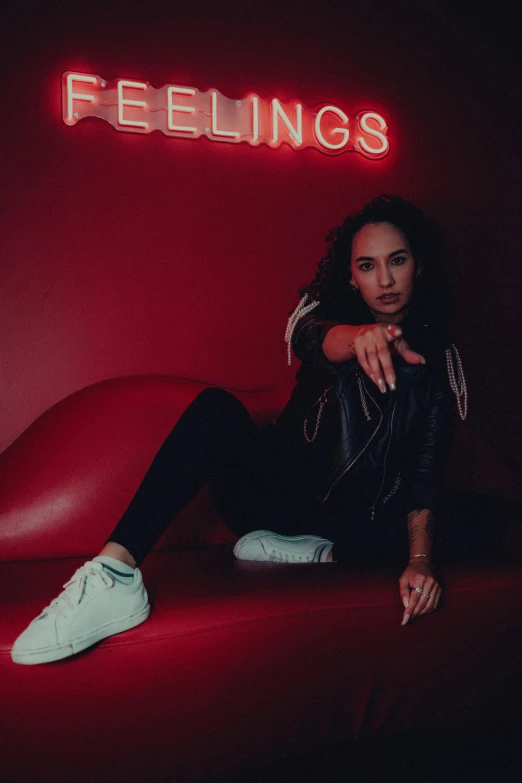 an image of woman with neon sign in the background