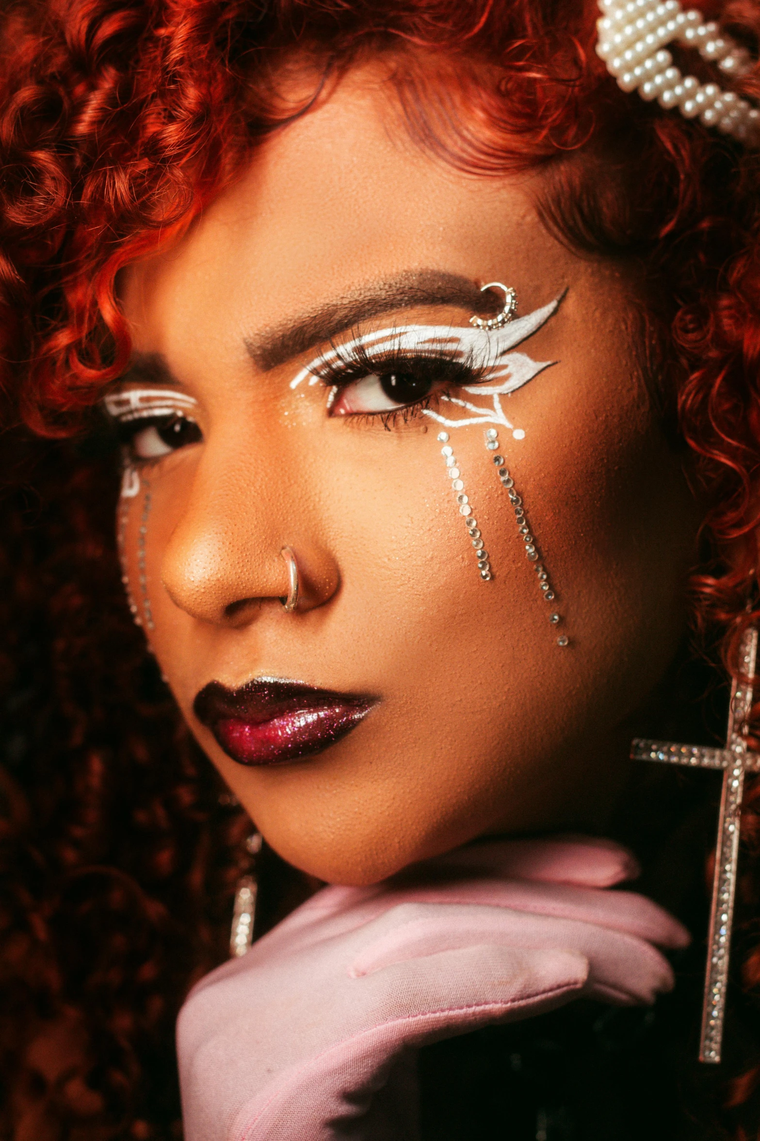 a close up po of a woman with white make - up and pearls