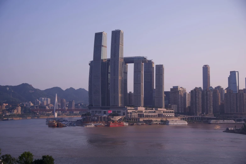 a view of some very tall buildings in the water