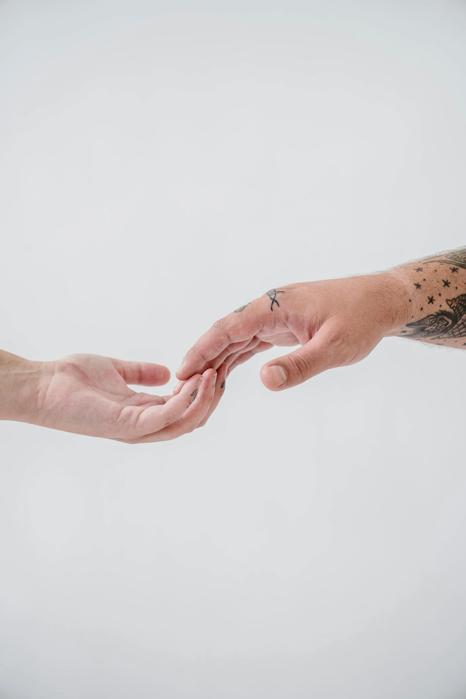 two men exchanging a piece of fruit with hands