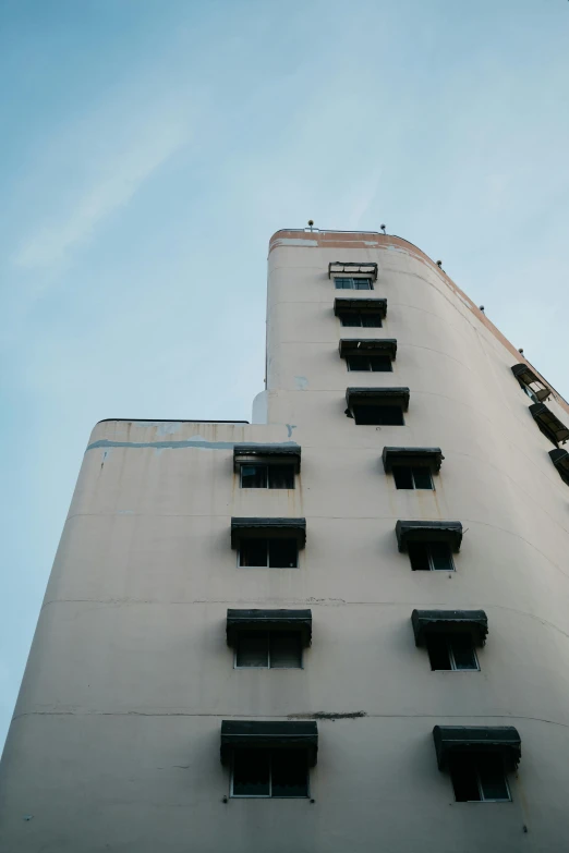 a building with window boxes on each floor