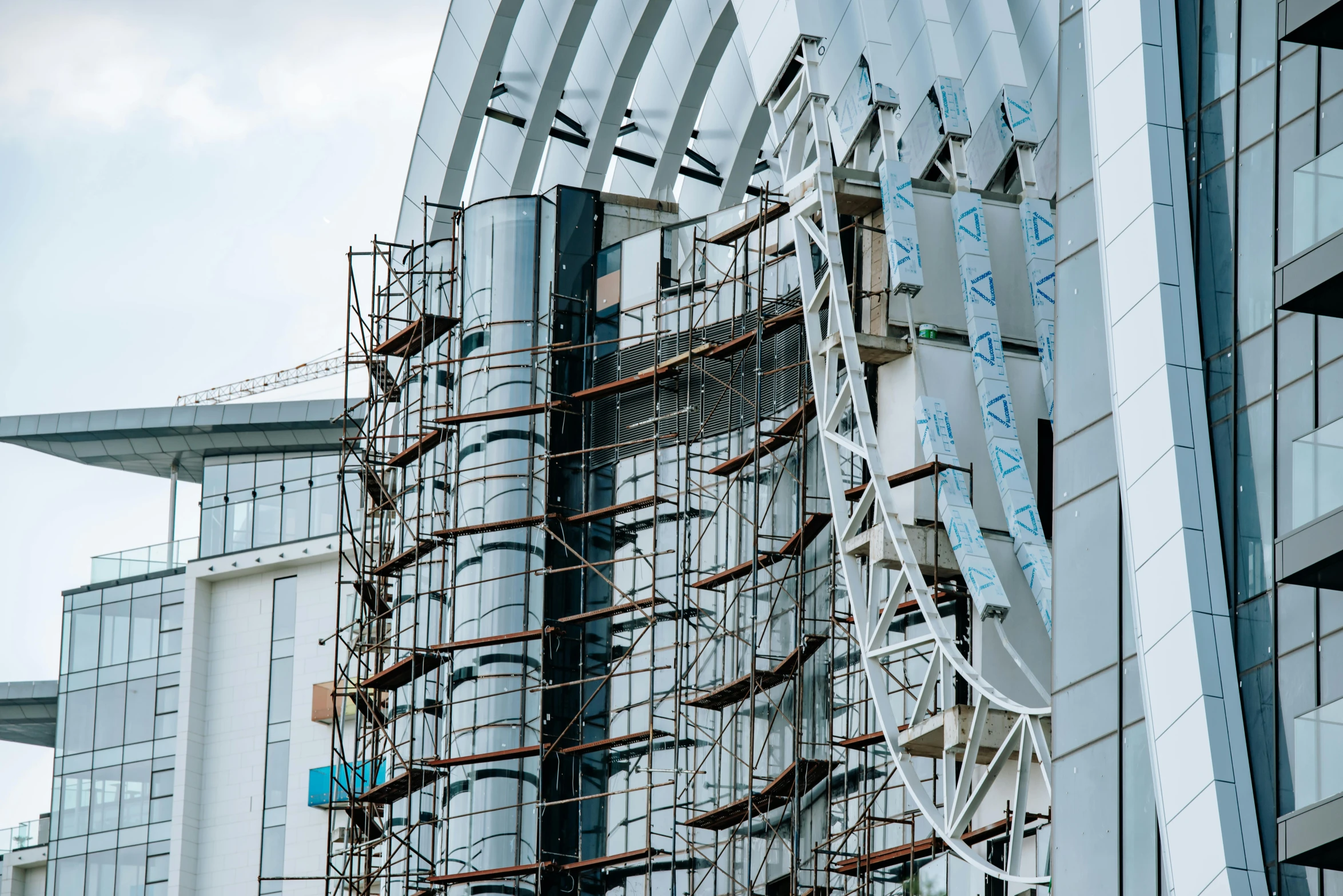 an odd looking building with metal pipes on the side