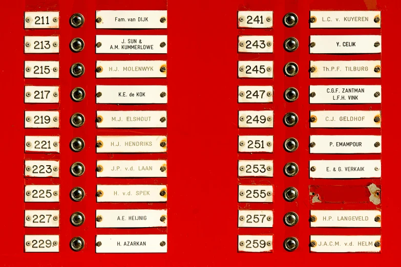 six large numbered labels placed on red surface