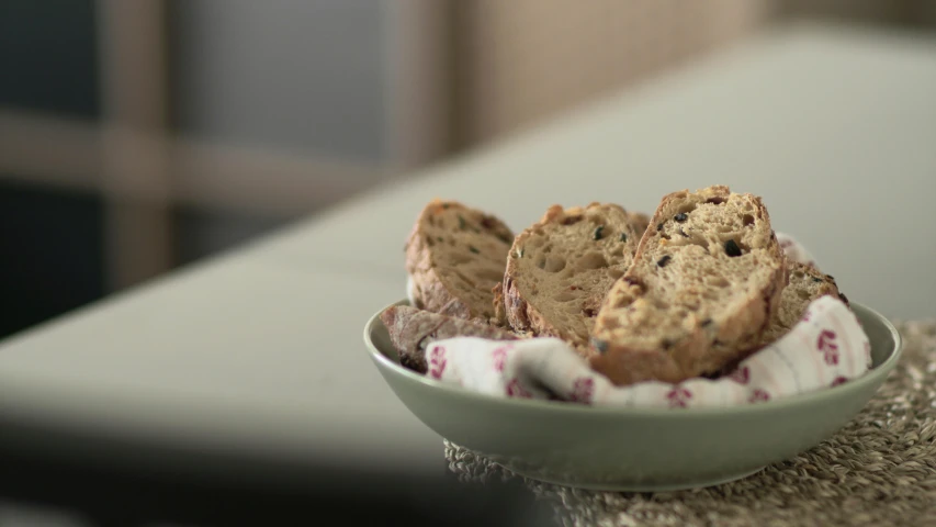 a bowl filled with sliced up cookies on top of a table