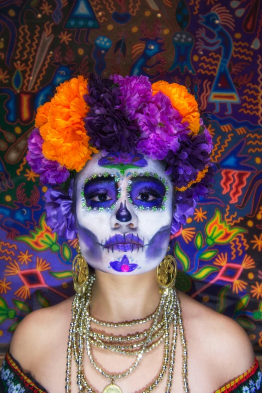 a girl with day of the dead face painting