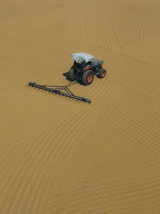 two men are riding on the back of a four - wheeled vehicle