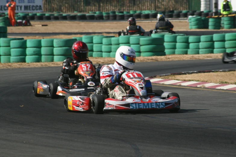 two racers race their motorbikes in a race