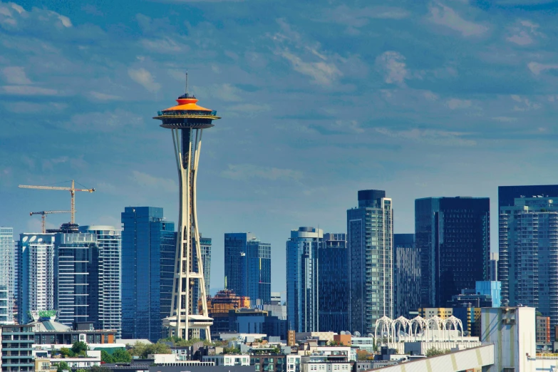 an urban skyline with tall buildings, a ferris wheel and a light tower