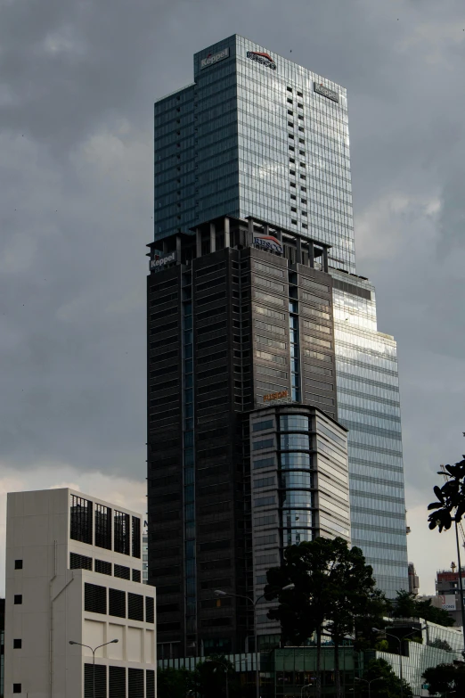 two buildings with a tall tower behind them