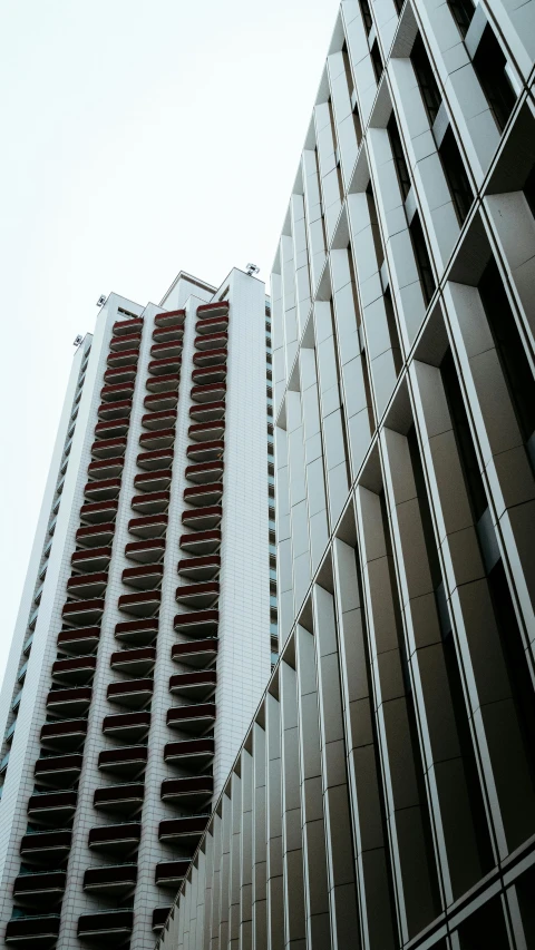 tall buildings on the side of a street, with windows