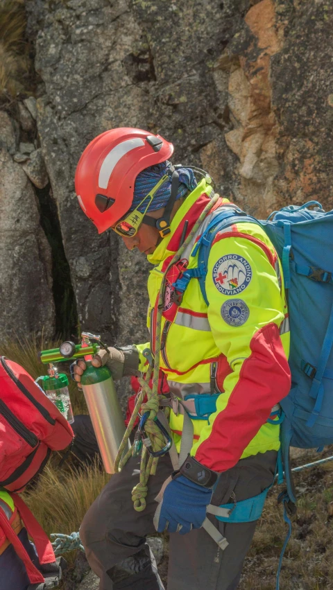 the man is climbing with his helmet on