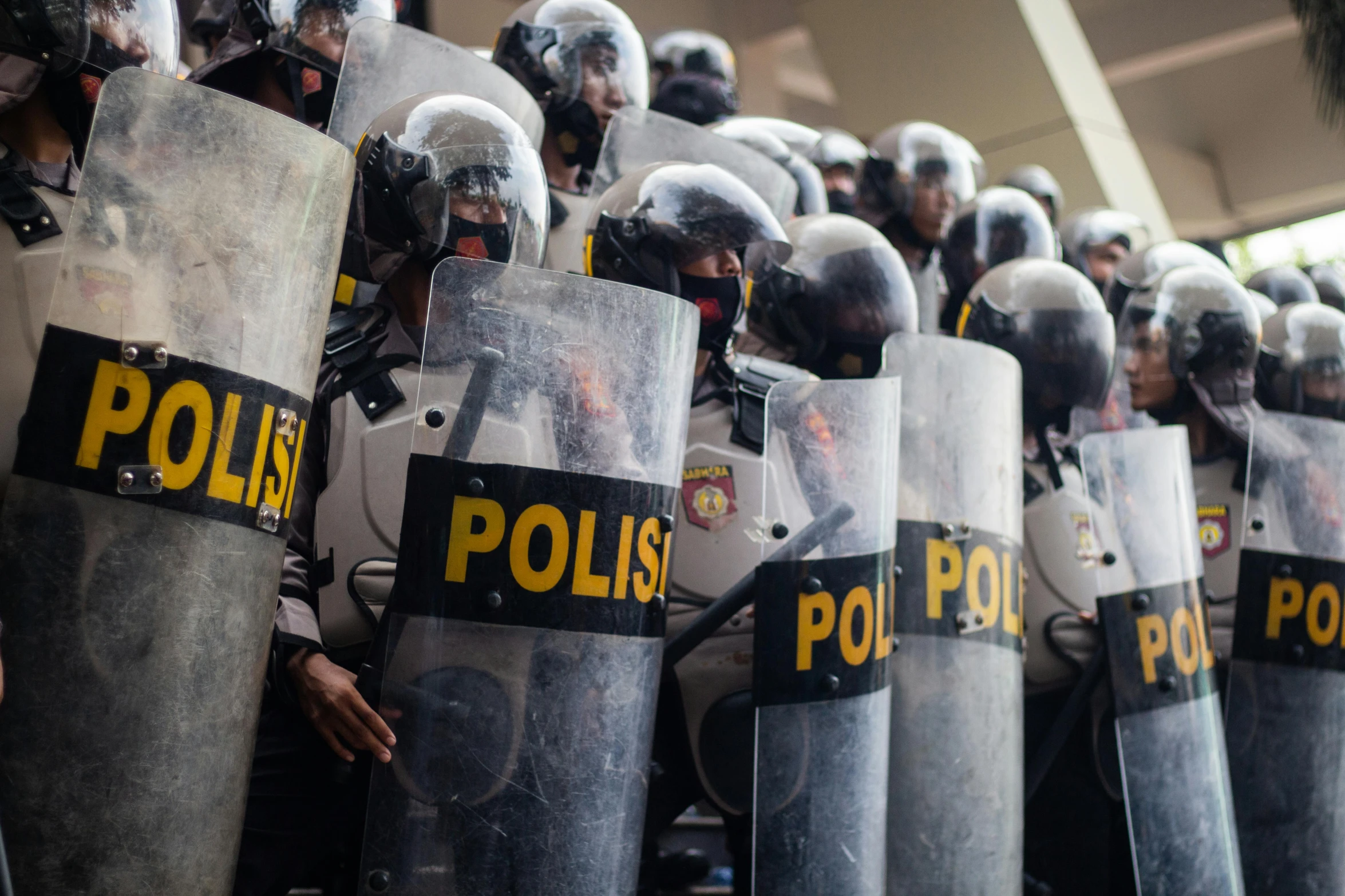 the policemen stand together in their protective gear