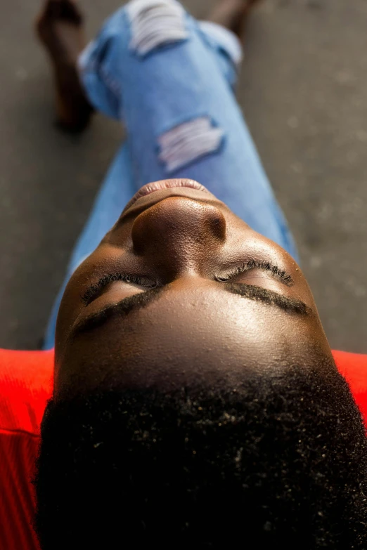 the woman is laying down on the road