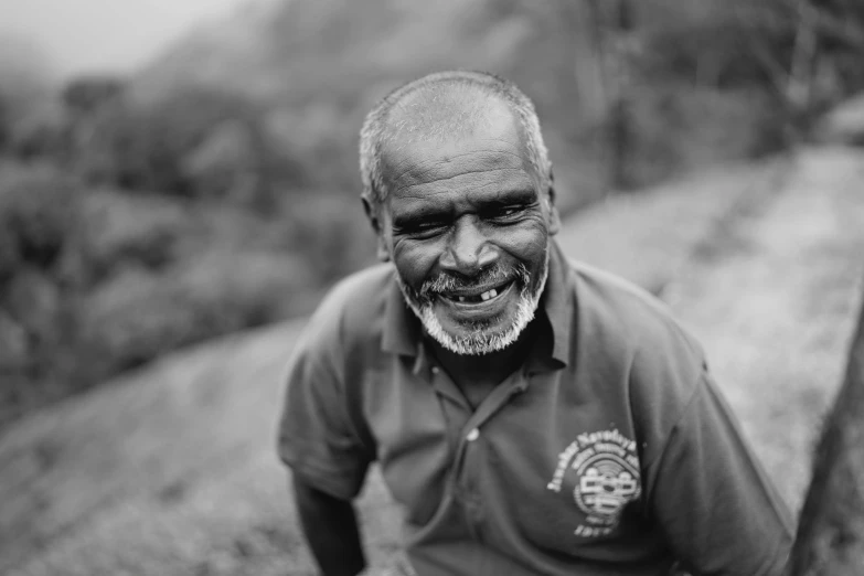 a man with a black and white po and a balding man with beard