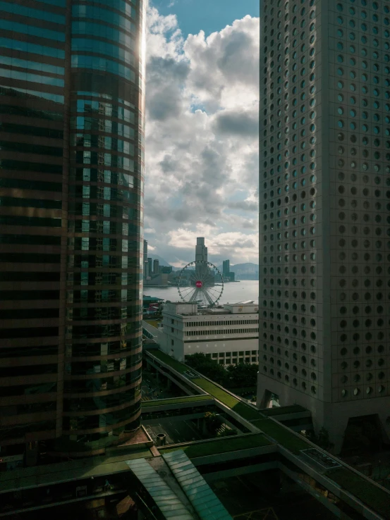 looking out the window at a city with tall buildings and water