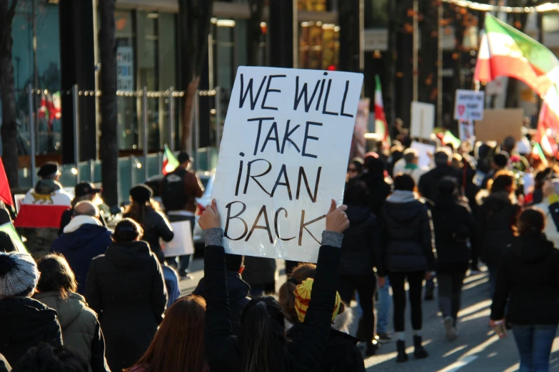 people walking on the street in protest of israel