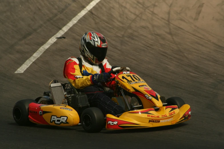 two people race on a go - cart on a track