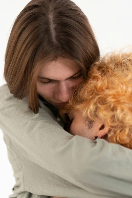 two women with hair that is hugging each other