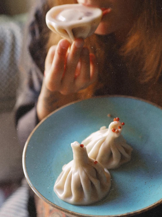 a person is holding up their bowl of food