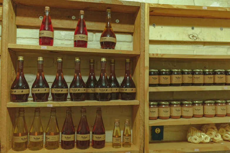 bottles and condiments on display on shelves in a store