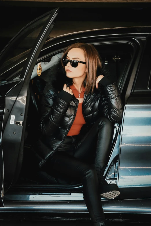 an image of woman sitting in a car