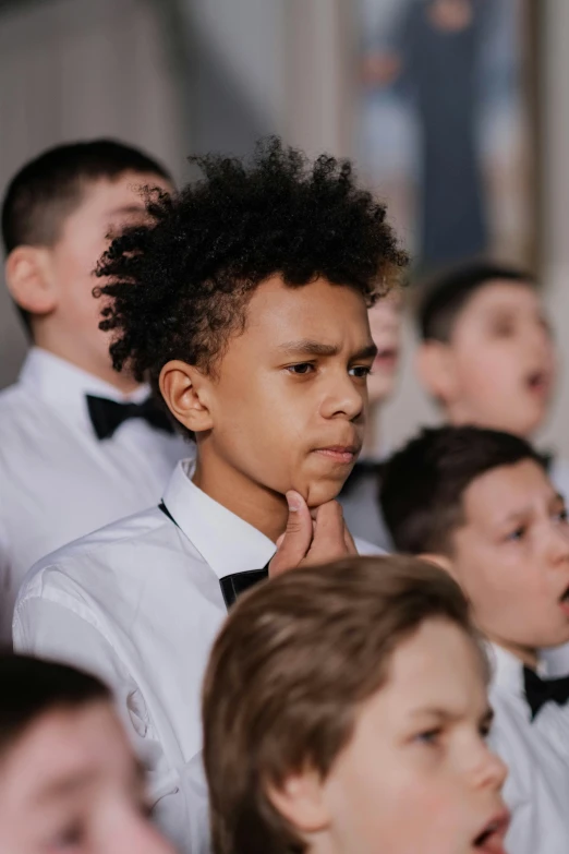 group of s singing in front of an audience