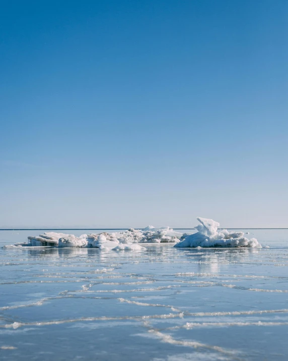 some icebergs that are floating in the water