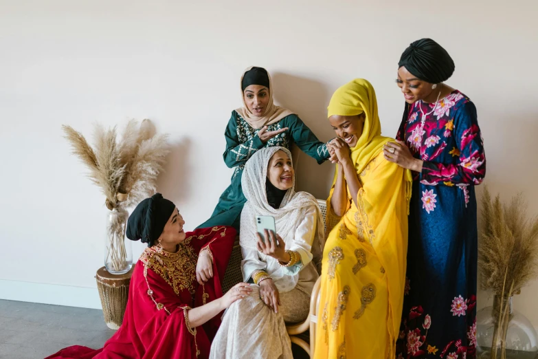 three woman and two women posing for a picture