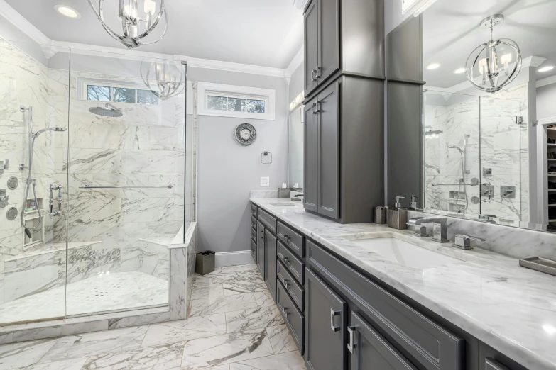 a white bathroom with two sinks, shower and mirror