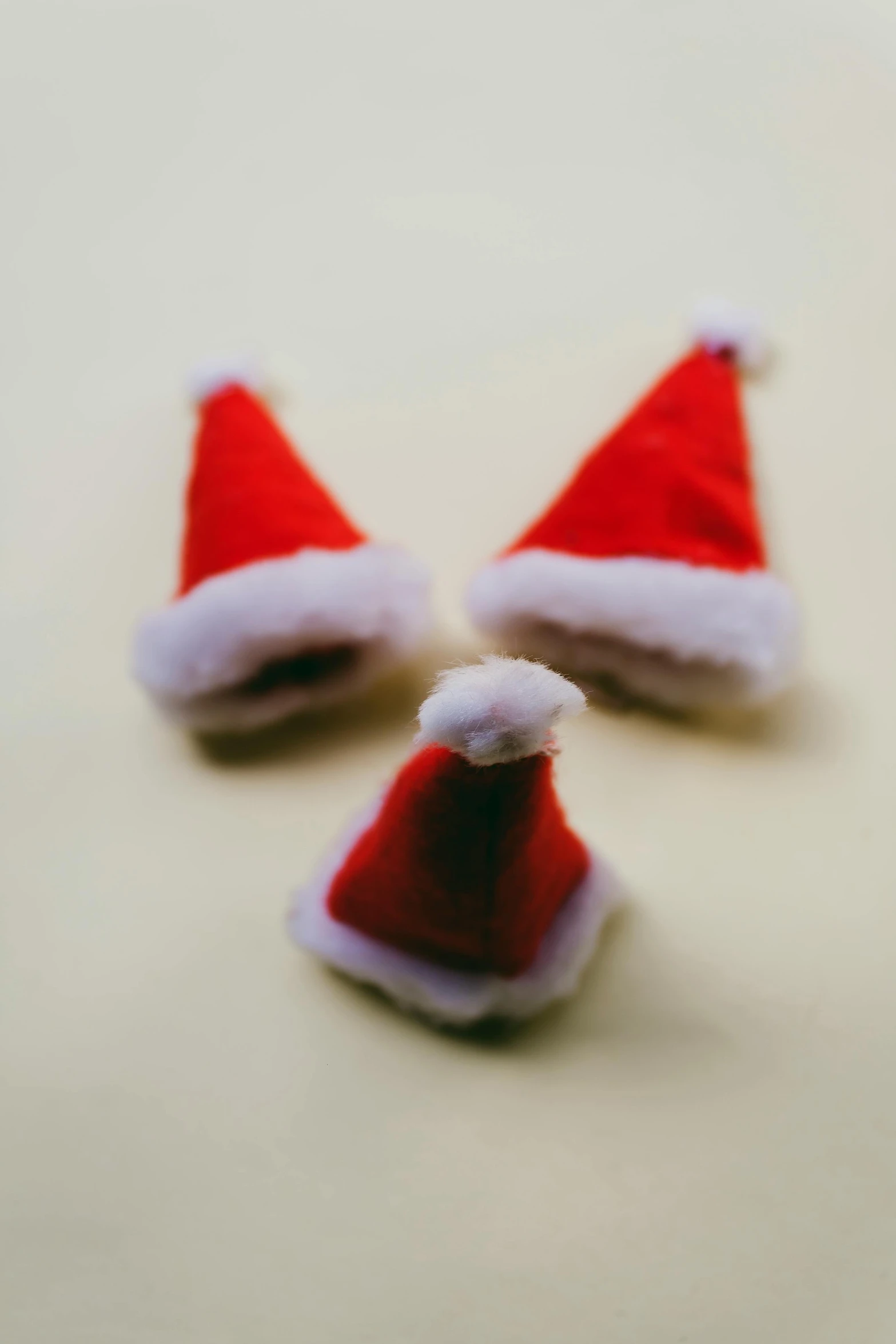 the two santa hats are placed on the counter