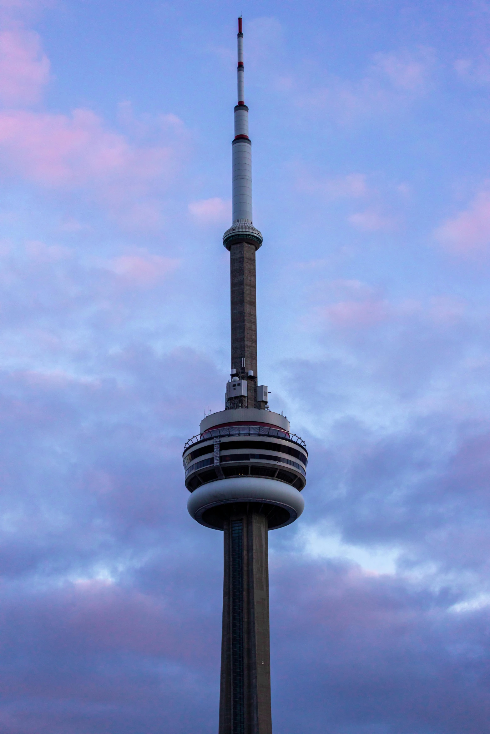 a very tall tall building on the top of a hill