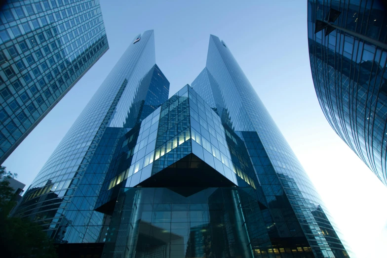 skyscrs near a road that are also surrounded by tall buildings