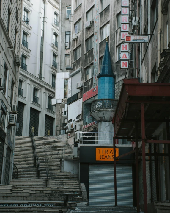 a city street has steps leading up to the top of buildings