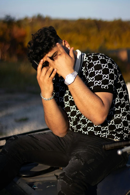 a man is talking on the phone while sitting in a vehicle