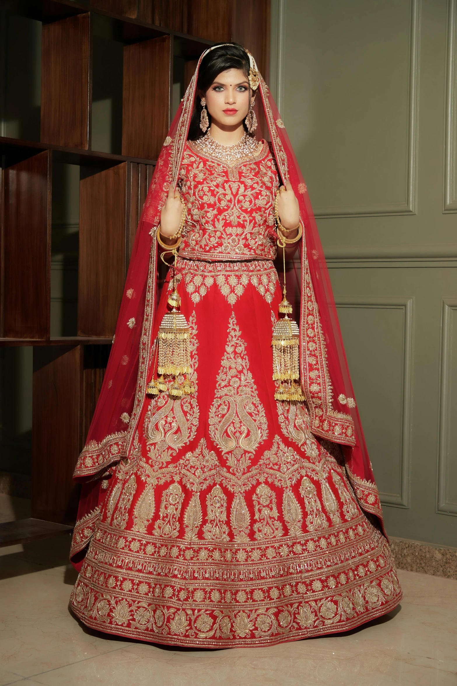 a woman in a red bridal gown