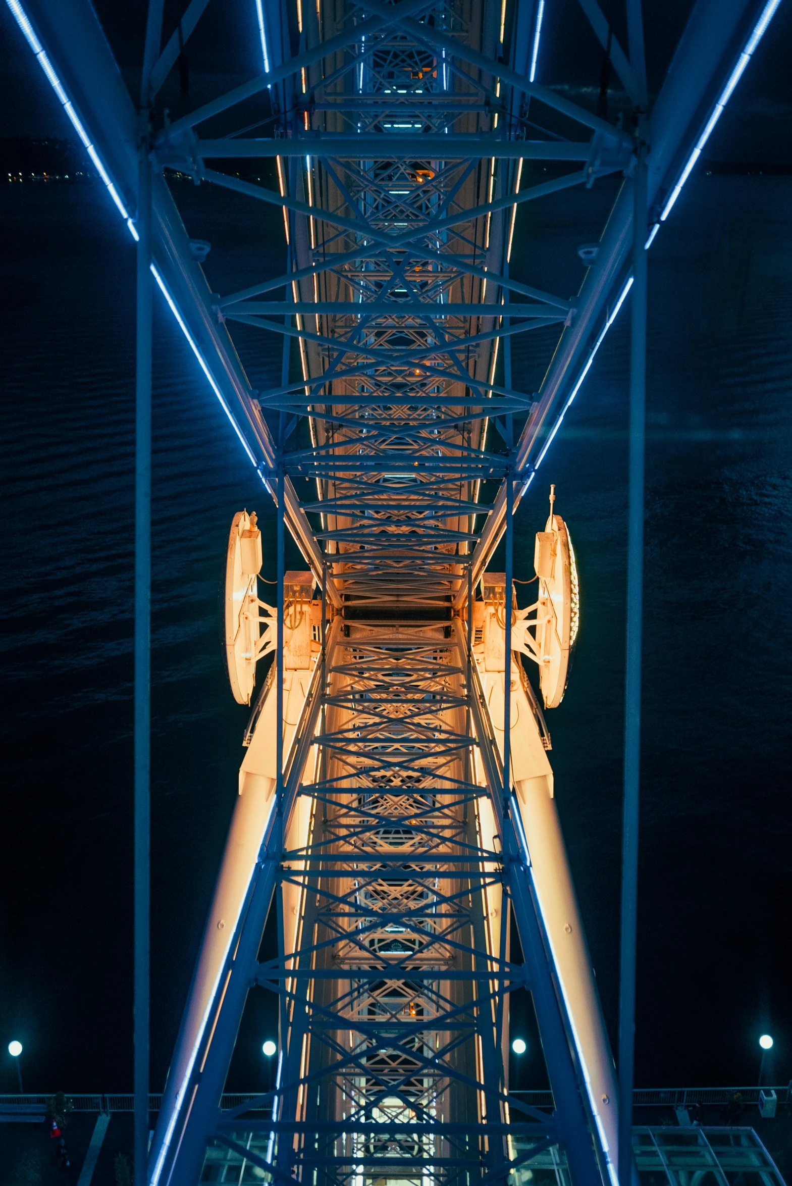 the view of a tall metal structure with an overhead staircase