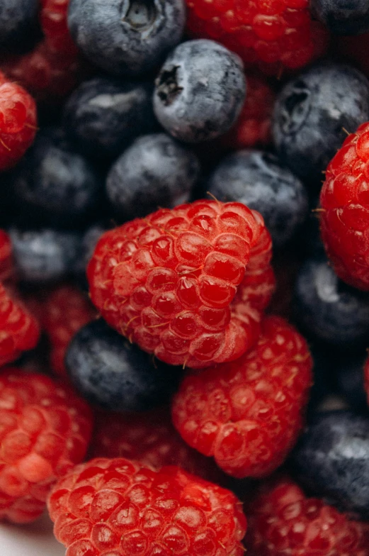 berry and blue berry salad with raspberries on the side