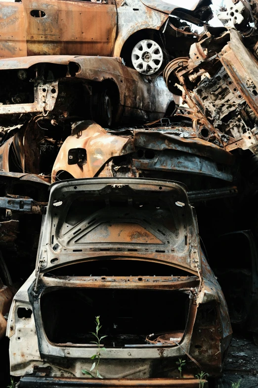 the wreckage of several abandoned cars is shown