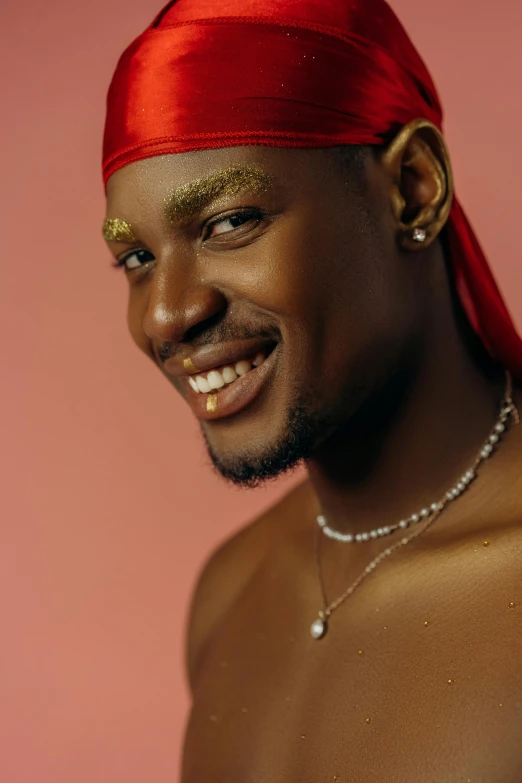 a person wearing a red bandana and smiling