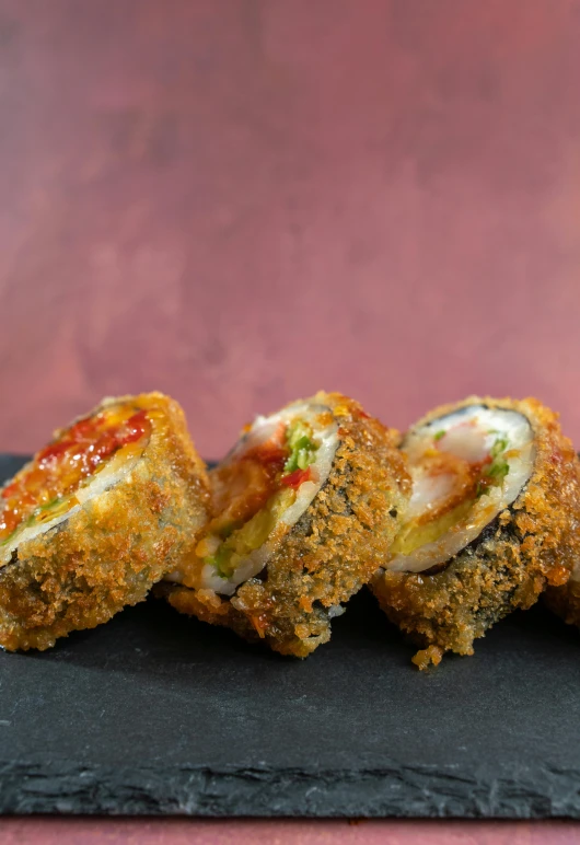 three different sized deep fried chicken in an individual sized dish